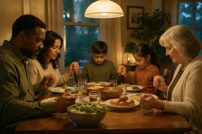 Family Holding Hands Before Dinner Prayer