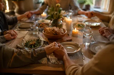 Christian Family Dinner Prayer Around Wooden Table