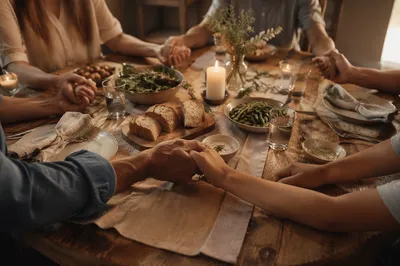 Christian Family Dinner Prayer Around Rustic Table