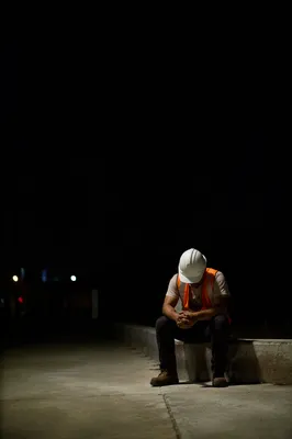 Construction Worker Prayer Break at Night