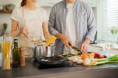 Couple Preparing Pasta in Bright Kitchen