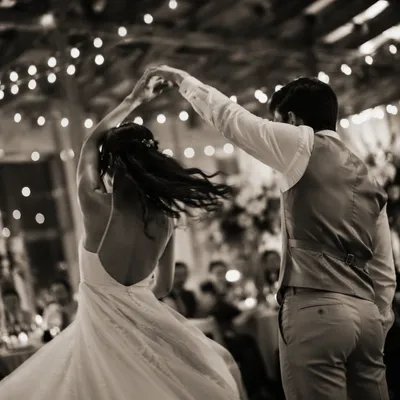Couples First Dance Under String Lights