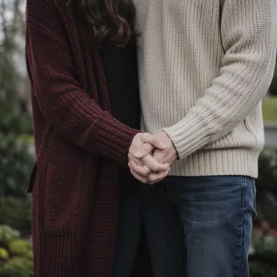 Couple Holding Hands in Outdoor Prayer