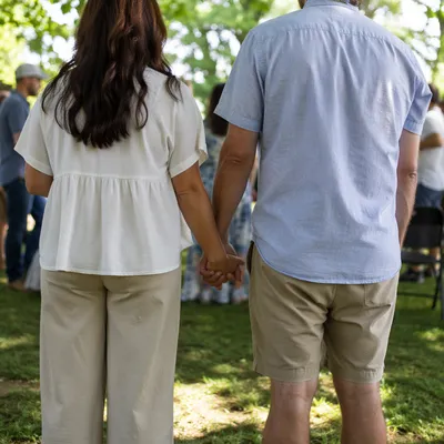Couple Praying Together at Outdoor Fellowship