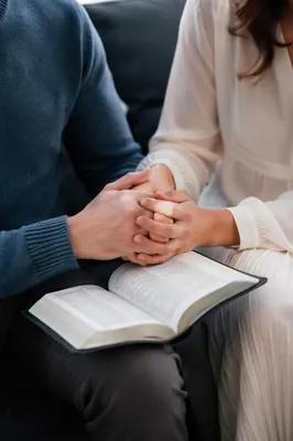 Couple Praying Together in Quiet Reflection