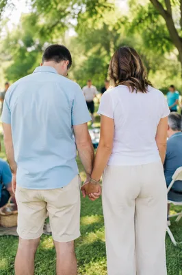 Couple Praying Together at Outdoor Fellowship