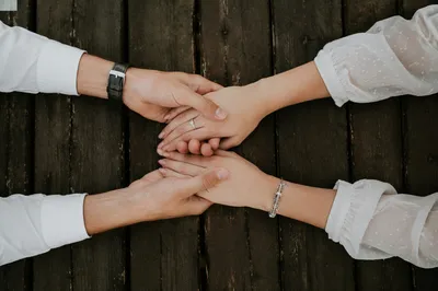Couple Praying Together Holding Hands
