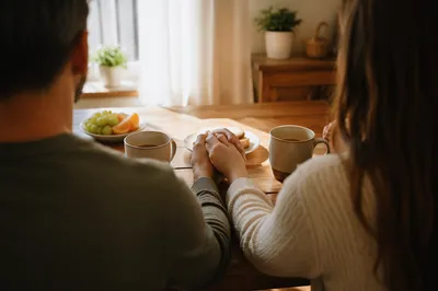 Couple Praying Together at Morning Table