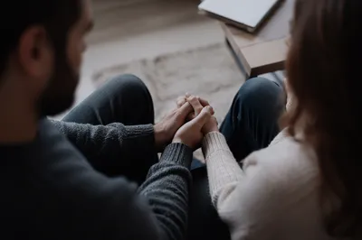 Couple Praying Together in Quiet Room