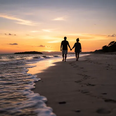 Couple Walking Hand in Hand at Sunset