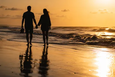 Romantic Couple Walking Beach at Sunset