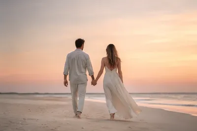 Couple Holding Hands on Sunset Beach