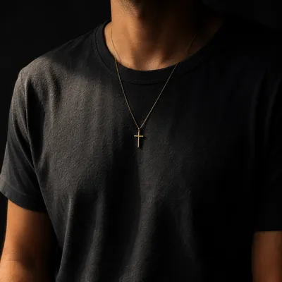 Gold Cross Necklace on Charcoal Shirt