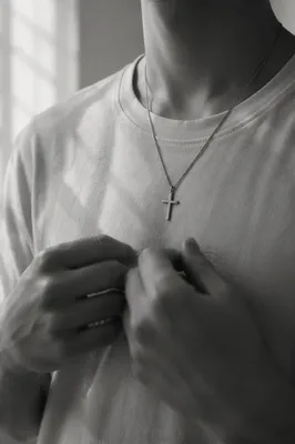 Silver Cross Pendant on Casual Shirt