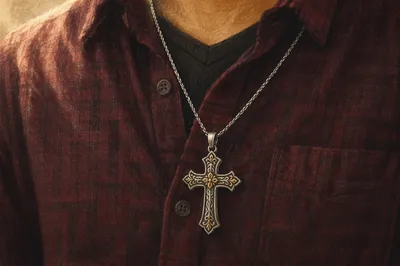 Silver Cross Necklace on Burgundy Shirt