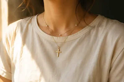 Gold Cross Necklace in Warm Window Light