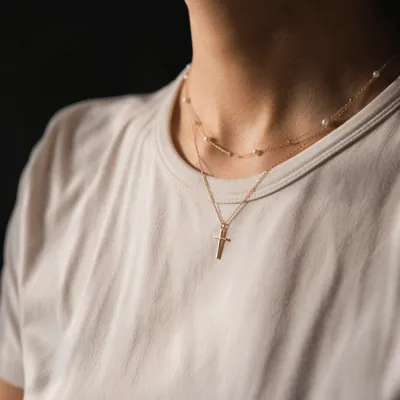 Gold Cross Necklace on Casual Shirt