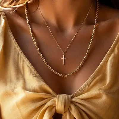 Gold Cross Necklace on Casual Linen