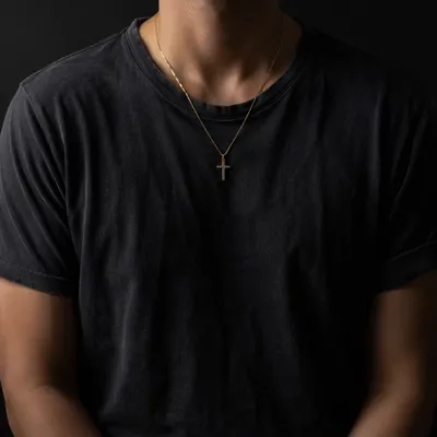 Gold Cross Necklace on Charcoal Shirt