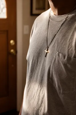 Simple Cross Necklace on Gray Shirt