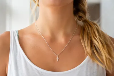 Silver Cross Necklace on Casual White Top