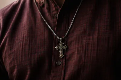 Silver Cross Necklace on Burgundy Shirt
