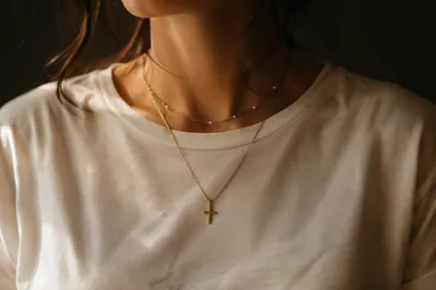 Gold Cross Necklace in Warm Window Light