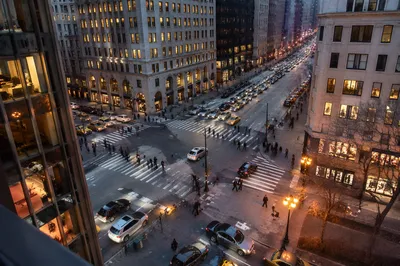 Busy Downtown Crosswalk at Dusk
