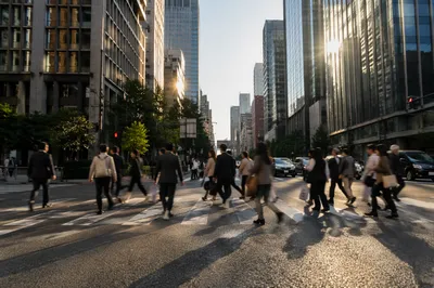 Busy Downtown Crosswalk at Sunset