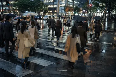 Busy Downtown Crosswalk at Early Evening