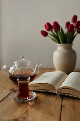 Open Book and Tea on Oak Table