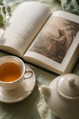 Open Book and Tea on Linen Table