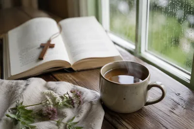 Open Devotional Book and Tea