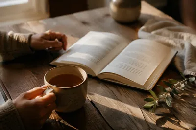Morning Tea and Open Book on Table