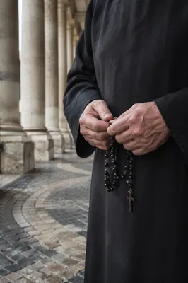 Elderly Hands Praying with Rosary Beads