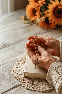 Elderly Hands Holding Rosary in Prayer