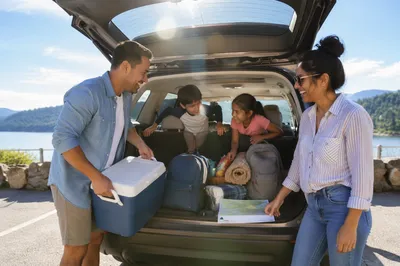 Family Packing SUV for Summer Road Trip