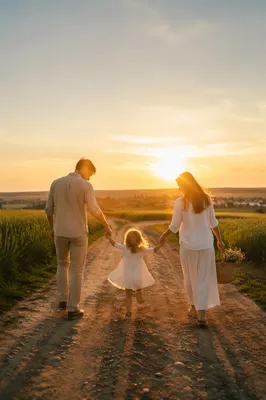 Family Walking Country Road at Sunset
