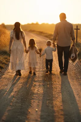 Family Walking Country Road at Sunset