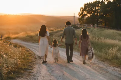 Family Walking Country Road at Sunset