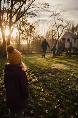 Father Playing with Children at Sunset