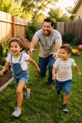Father Playing Chase with Children Backyard