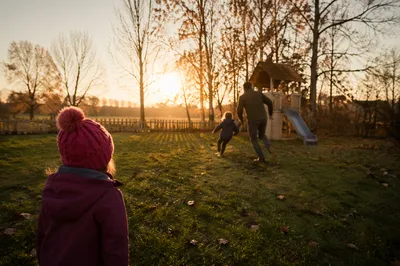 Father Playing with Children at Sunset