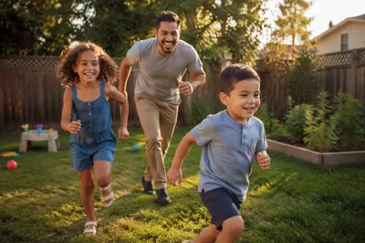 Father Playing Chase with Kids Backyard