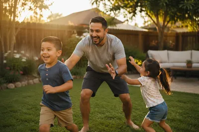 Father Playing Tag with Children Backyard