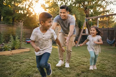 Father Playing Tag with Children Backyard