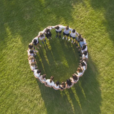 Aerial Circle Hug on Green Lawn