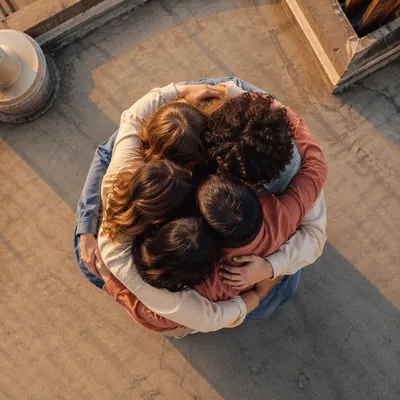 Overhead Friends Group Hug at Golden Hour