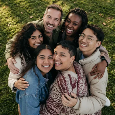 Diverse Friends Group Hug in Park
