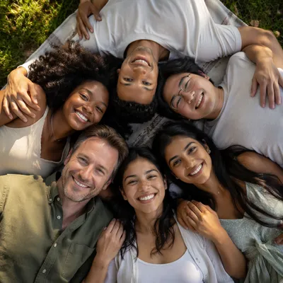 Six Friends Hugging in Park Circle